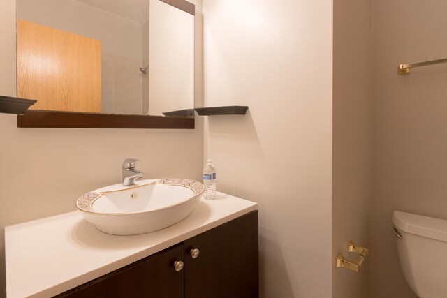 unfurnished bedroom with baseboards, visible vents, dark wood-style floors, and a closet