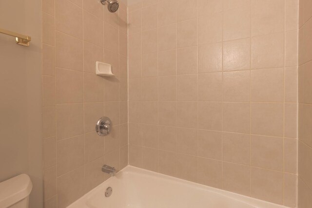 full bath featuring bathing tub / shower combination and toilet