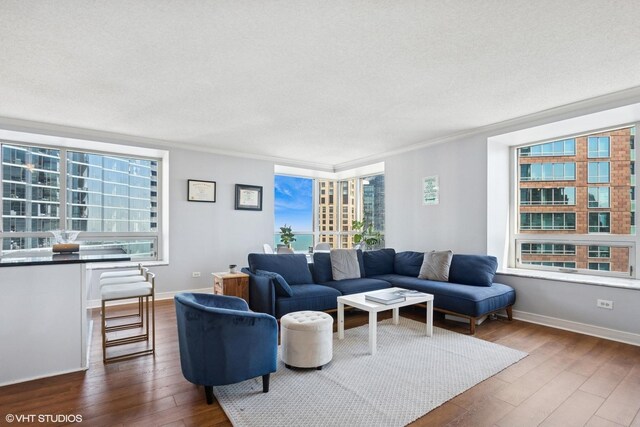 512 N Mcclurg Ct Unit 3304, Chicago, IL 60611 - living area with baseboards, ornamental molding, and dark wood-style flooring