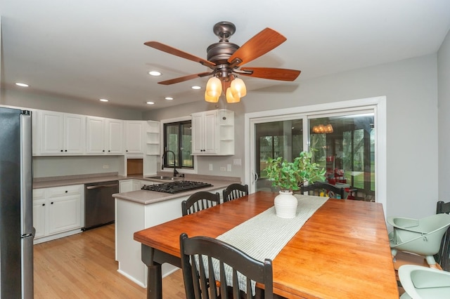 kitchen with open shelves, recessed lighting, white cabinetry, and appliances with stainless steel finishes