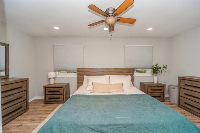 bedroom with ceiling fan, baseboards, wood finished floors, and recessed lighting