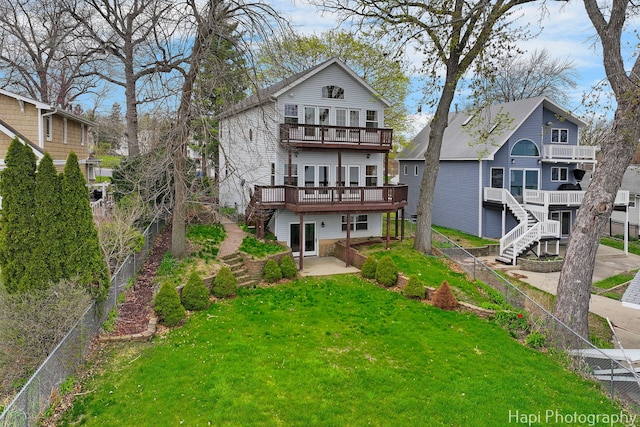 9 Lakeside Ln, Fox Lake, IL 60020 - rear view of house with stairway, a wooden deck, and a balcony