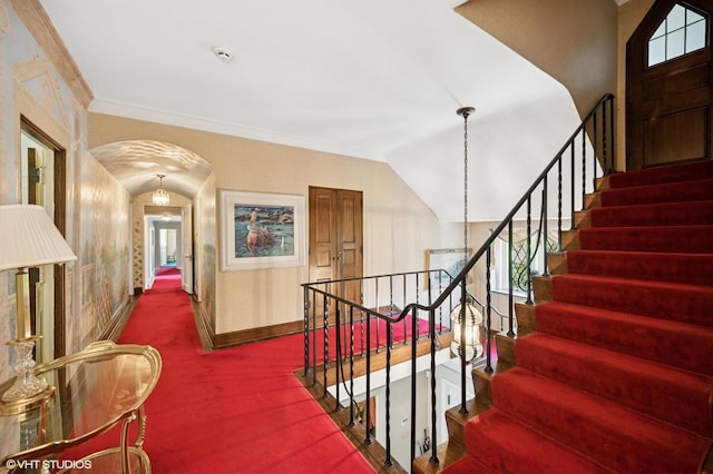 1250 Westmoor Rd, Winnetka, IL 60093 - stairs with baseboards, arched walkways, carpet floors, ornamental molding, and plenty of natural light