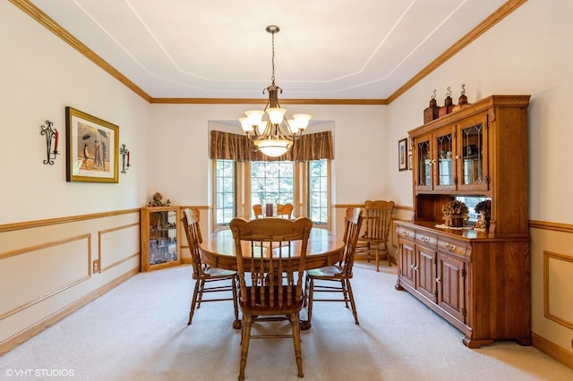 13 W Royal Oaks Dr, Bristol, IL 60512 - dining space featuring a chandelier, light carpet, a wainscoted wall, crown molding, and a decorative wall