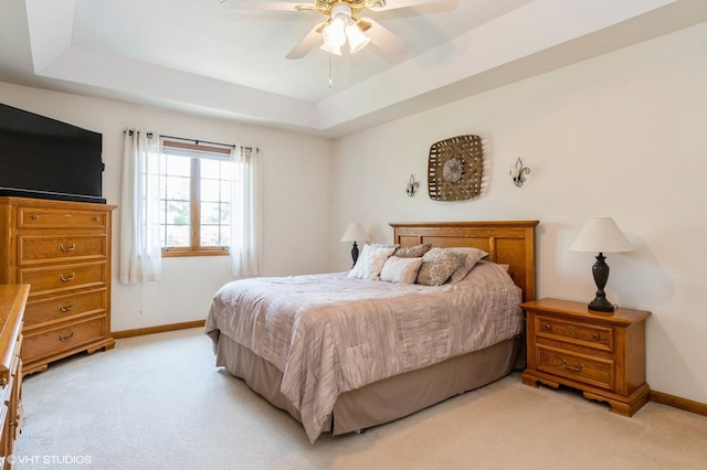 13 W Royal Oaks Dr, Bristol, IL 60512 - bedroom featuring light colored carpet, a tray ceiling, and baseboards