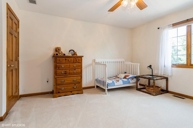 13 W Royal Oaks Dr, Bristol, IL 60512 - bedroom with light colored carpet, baseboards, and ceiling fan