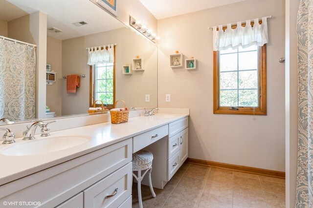 13 W Royal Oaks Dr, Bristol, IL 60512 - bathroom with double vanity, toilet, baseboards, and tile patterned floors