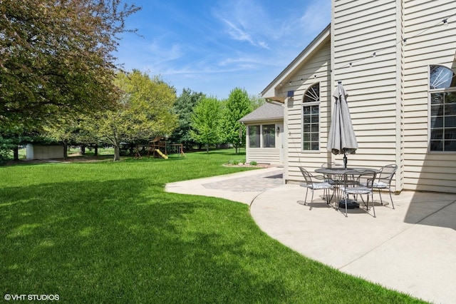 13 W Royal Oaks Dr, Bristol, IL 60512 - view of green lawn with a playground and a patio area