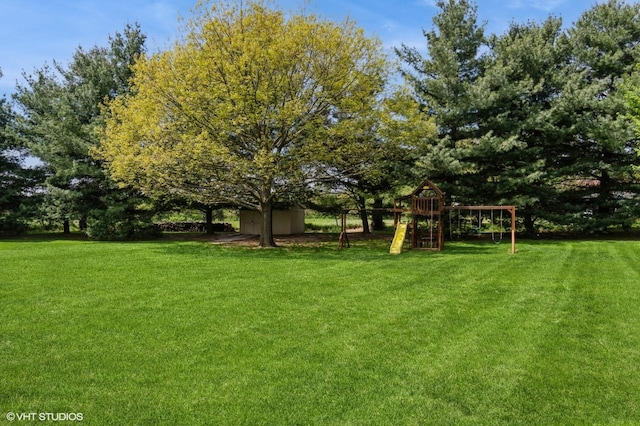 13 W Royal Oaks Dr, Bristol, IL 60512 - view of grassy yard with a playground