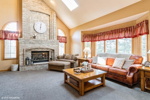 13 W Royal Oaks Dr, Bristol, IL 60512 - carpeted living area featuring high vaulted ceiling, a skylight, and a brick fireplace
