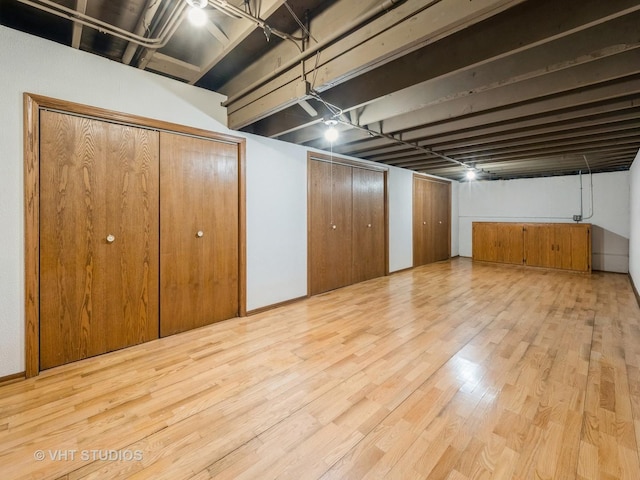 finished below grade area featuring wood finished floors