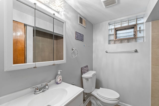 17148 William St, Lansing, IL 60438 - bathroom with toilet, visible vents, and vanity