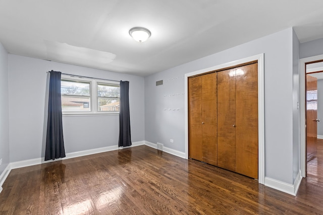 17148 William St, Lansing, IL 60438 - unfurnished bedroom with baseboards, visible vents, wood finished floors, and a closet