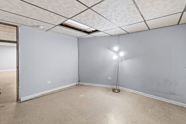 17148 William St, Lansing, IL 60438 - empty room featuring tile patterned floors, a paneled ceiling, and baseboards