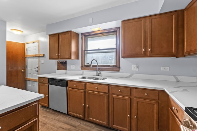 17148 William St, Lansing, IL 60438 - kitchen with light stone counters, stainless steel appliances, brown cabinetry, and a sink