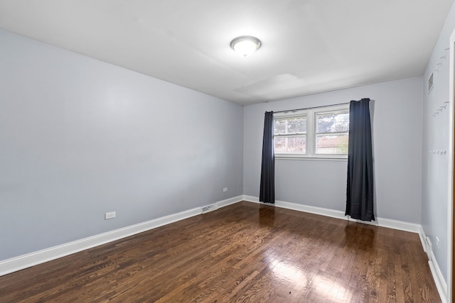 17148 William St, Lansing, IL 60438 - spare room featuring wood finished floors, visible vents, and baseboards