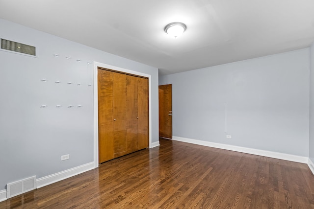 17148 William St, Lansing, IL 60438 - unfurnished bedroom with baseboards, visible vents, wood finished floors, and a closet