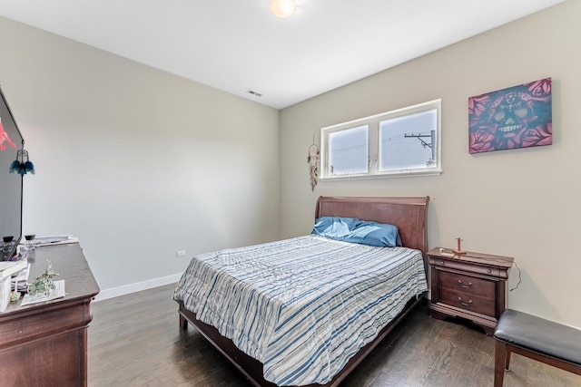 2143 W 19th St Unit 3, Chicago, IL 60608 - bedroom with baseboards, visible vents, and dark wood-type flooring