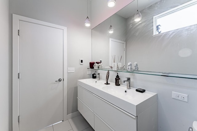 2143 W 19th St Unit 3, Chicago, IL 60608 - bathroom featuring double vanity, a sink, baseboards, and tile patterned flooring