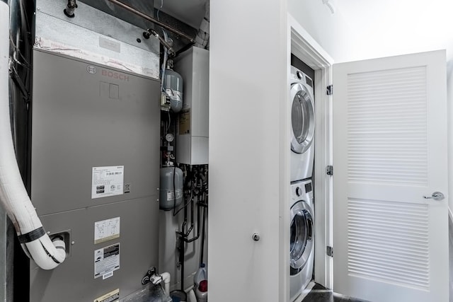 2143 W 19th St Unit 3, Chicago, IL 60608 - clothes washing area with stacked washer / drying machine, heating unit, and laundry area