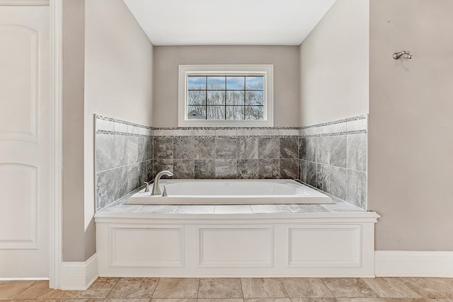 full bathroom with a bath and tile patterned floors