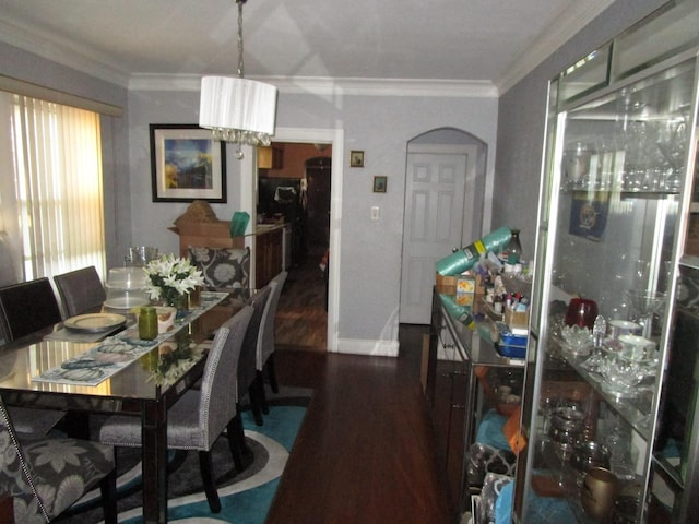 9201 S Marshfield Ave, Chicago, IL 60620 - dining area with wood finished floors, arched walkways, a chandelier, ornamental molding, and baseboards