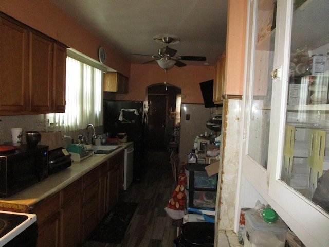 9201 S Marshfield Ave, Chicago, IL 60620 - kitchen with a ceiling fan, a sink, brown cabinetry, light countertops, and dark wood finished floors