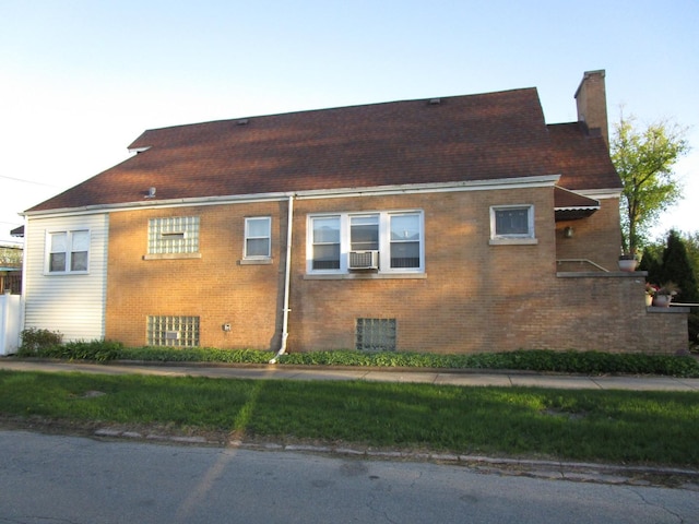 9201 S Marshfield Ave, Chicago, IL 60620 - view of side of home with brick siding, a chimney, and cooling unit