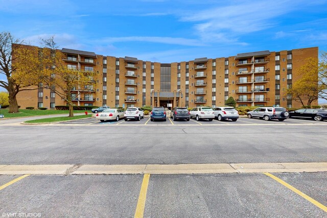 view of property with uncovered parking