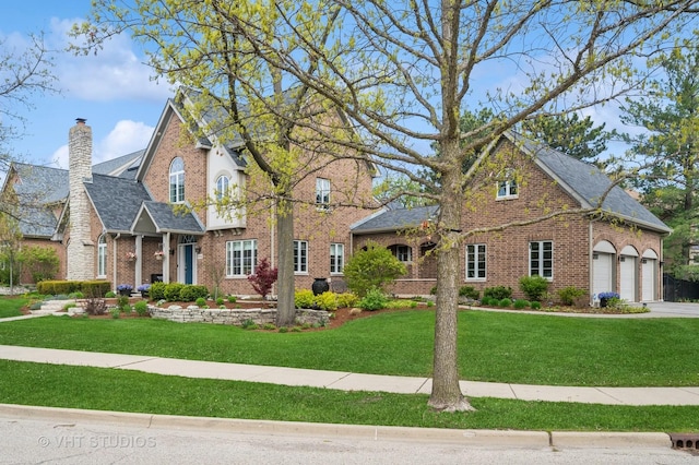 3118 Oliver Ln, Northbrook, IL 60062 - traditional-style house with brick siding, a front yard, and a chimney