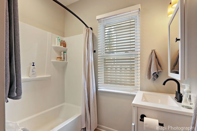 bathroom with vanity and shower / bath combination with curtain