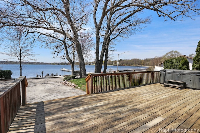 wooden deck featuring a water view