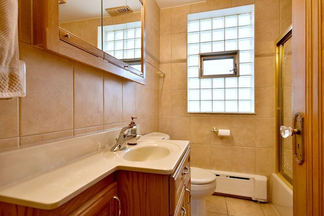 full bath featuring a baseboard heating unit, toilet, visible vents, tile patterned flooring, and vanity