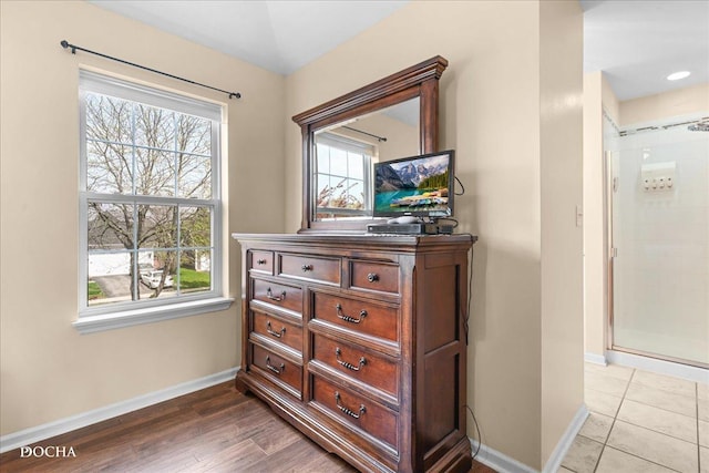 interior details featuring baseboards and wood finished floors