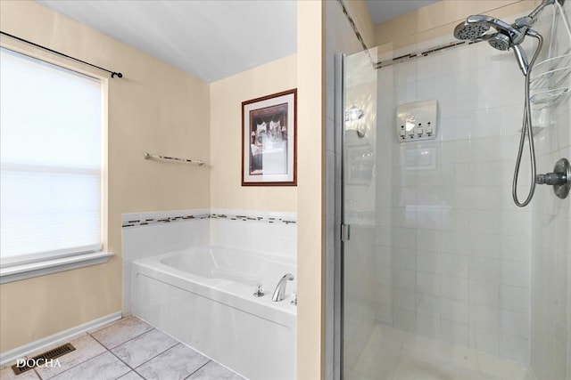 full bath with visible vents, baseboards, a bath, tile patterned floors, and a shower stall