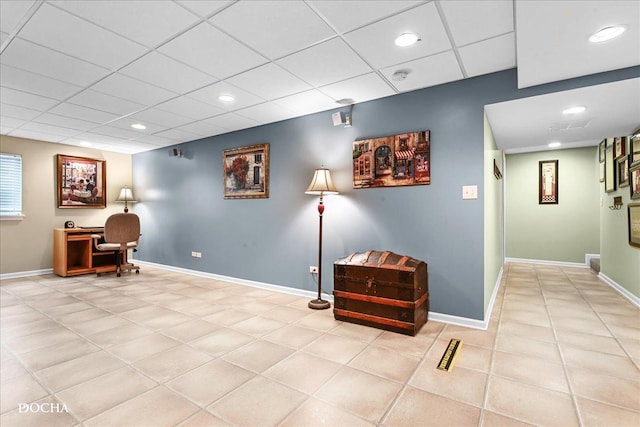 home office featuring light tile patterned floors, baseboards, a drop ceiling, and recessed lighting