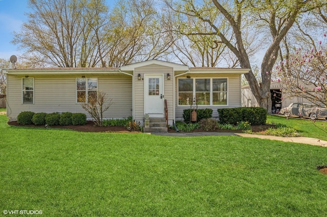 view of front of home featuring a front yard and entry steps