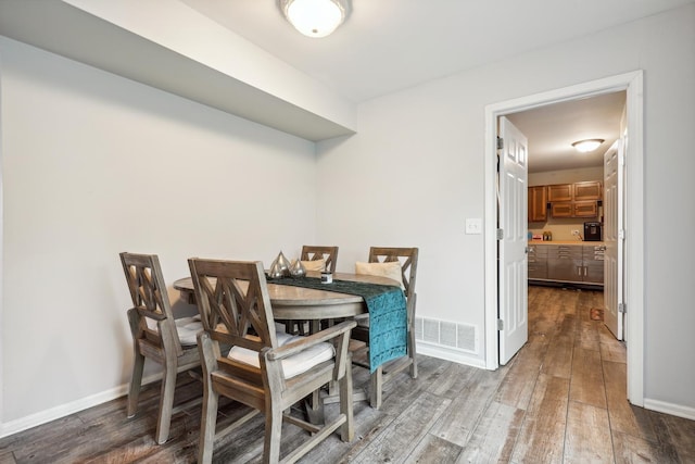 1306 Haverhill Cir, Naperville, IL 60563 - dining room featuring dark wood-type flooring and baseboards