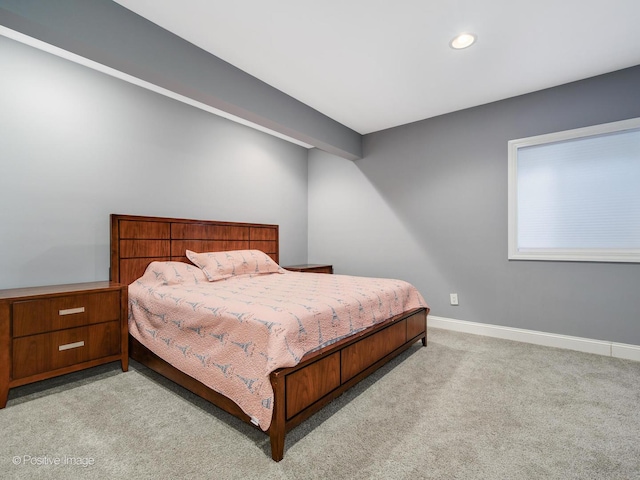bedroom with baseboards, recessed lighting, and carpet