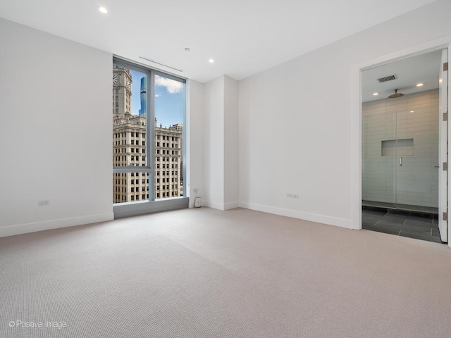 403 N Wabash Ave Unit 13B, Chicago, IL 60611 - carpeted empty room with baseboards and recessed lighting