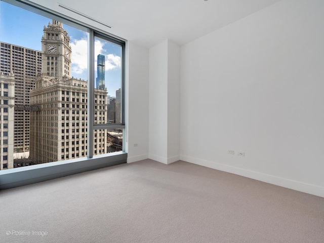 403 N Wabash Ave Unit 13B, Chicago, IL 60611 - empty room with carpet floors, a city view, and floor to ceiling windows