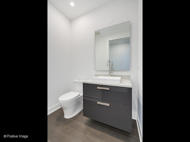 403 N Wabash Ave Unit 13B, Chicago, IL 60611 - bathroom featuring vanity, wood finished floors, and recessed lighting