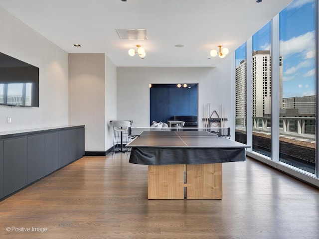 403 N Wabash Ave Unit 13B, Chicago, IL 60611 - kitchen with dark wood-style flooring, dark countertops, plenty of natural light, and modern cabinets