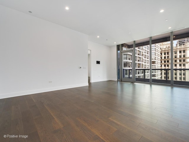403 N Wabash Ave Unit 13B, Chicago, IL 60611 - spare room featuring wood finished floors, recessed lighting, and expansive windows