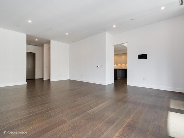 403 N Wabash Ave Unit 13B, Chicago, IL 60611 - unfurnished room with dark wood-type flooring and recessed lighting