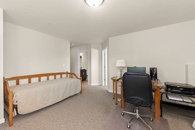 carpeted bedroom with baseboards