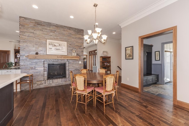 14431 E 2400 N Rd, Hudson, IL 61748 - dining space with ornamental molding, a stone fireplace, dark wood finished floors, recessed lighting, and a chandelier