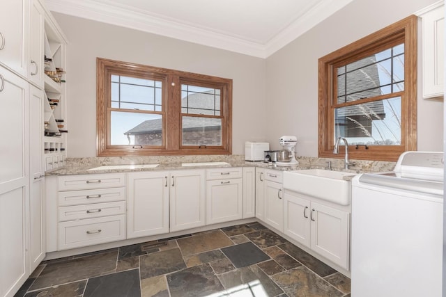 14431 E 2400 N Rd, Hudson, IL 61748 - washroom featuring washer / dryer, cabinet space, ornamental molding, stone tile flooring, and plenty of natural light