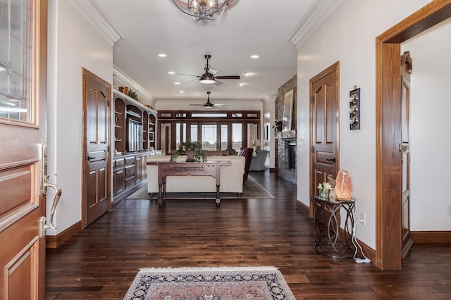 14431 E 2400 N Rd, Hudson, IL 61748 - entryway featuring crown molding, dark wood-style floors, a fireplace, baseboards, and ceiling fan