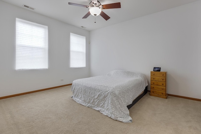 bedroom featuring carpet, visible vents, and baseboards